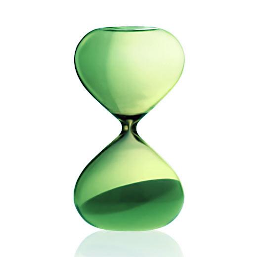 Green glass hourglass with pale sand, standing upright against a white background.