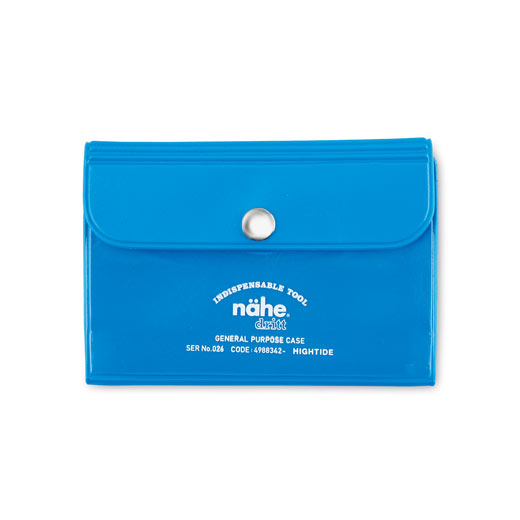 Blue Nähe card case with a snap-button flap and white printed lettering across the front.